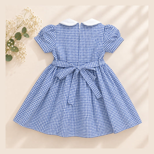 Blue gingham girls dress with white collar and waist bow - back view
