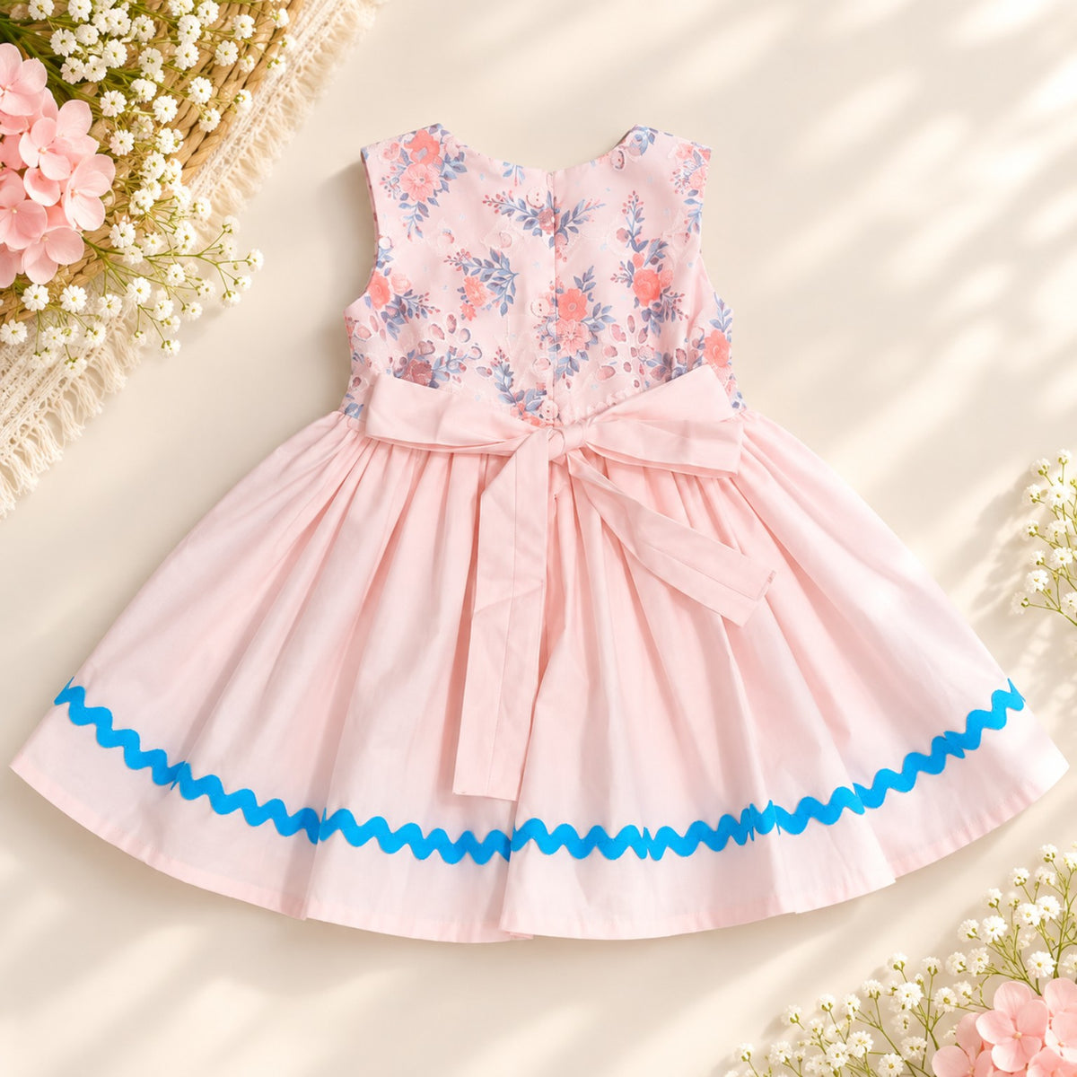 Back of pink floral cotton girls dress with tie belt and blue trim - Elfin Kidz