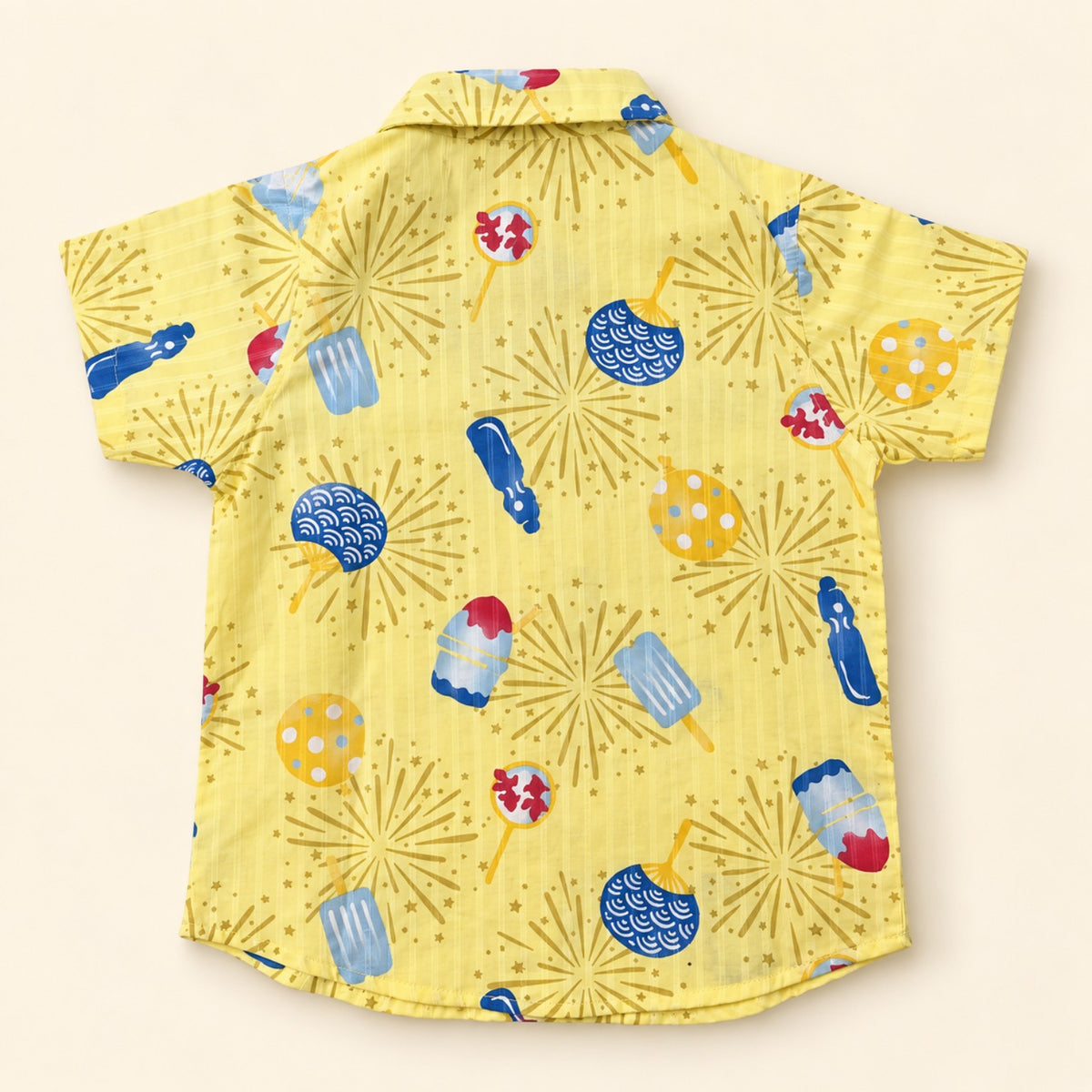 Back of yellow 100% cotton boys shirt with colourful fireworks and ice pop print