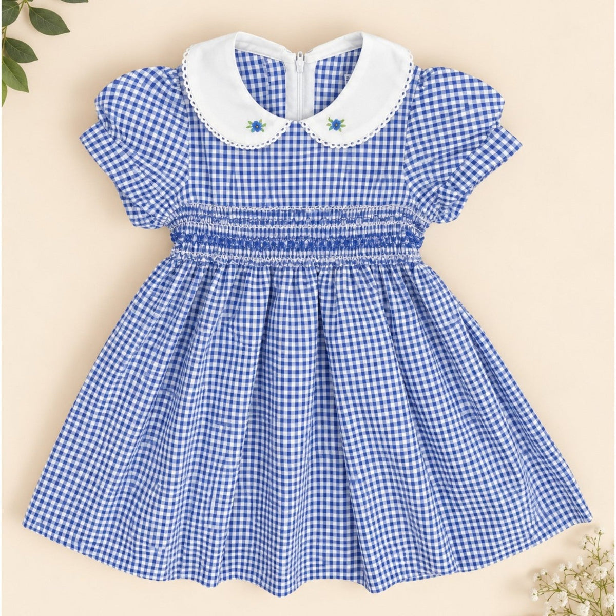 Blue gingham girls dress with white Peter Pan collar and smocked waist - front view