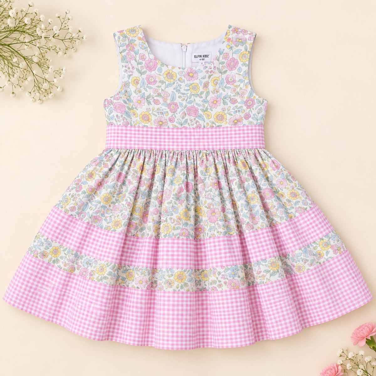 Girls floral cotton dress with pink gingham trim and full skirt - front view