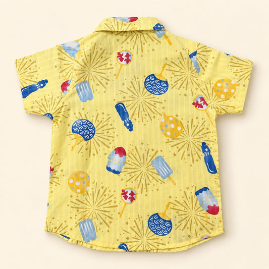 Back of yellow 100% cotton boys shirt with colourful fireworks and ice pop print